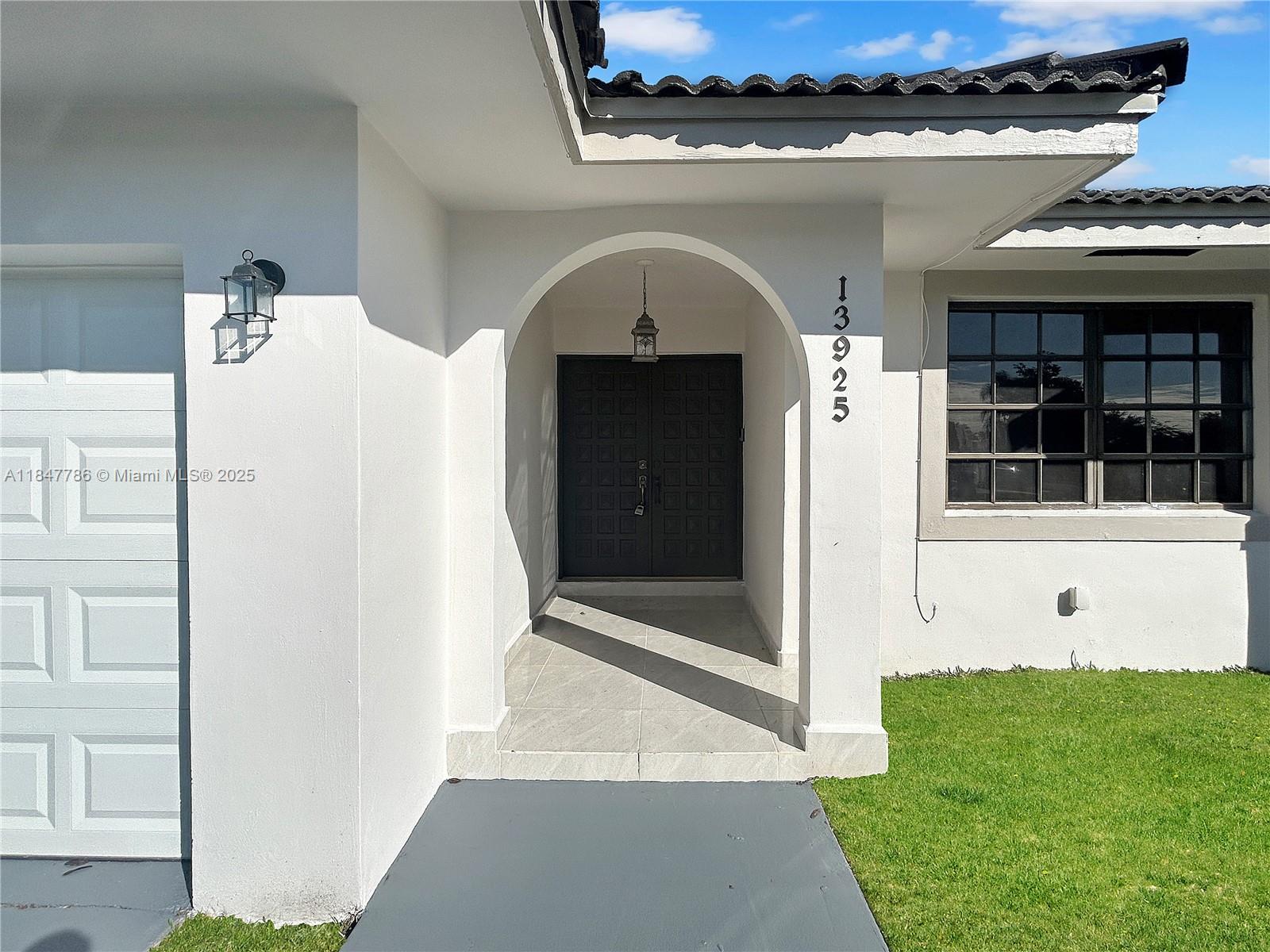 13925 Southwest 26th Terrace Miami, FL 33175 - Photo 4 of 36 a view of a door of the house