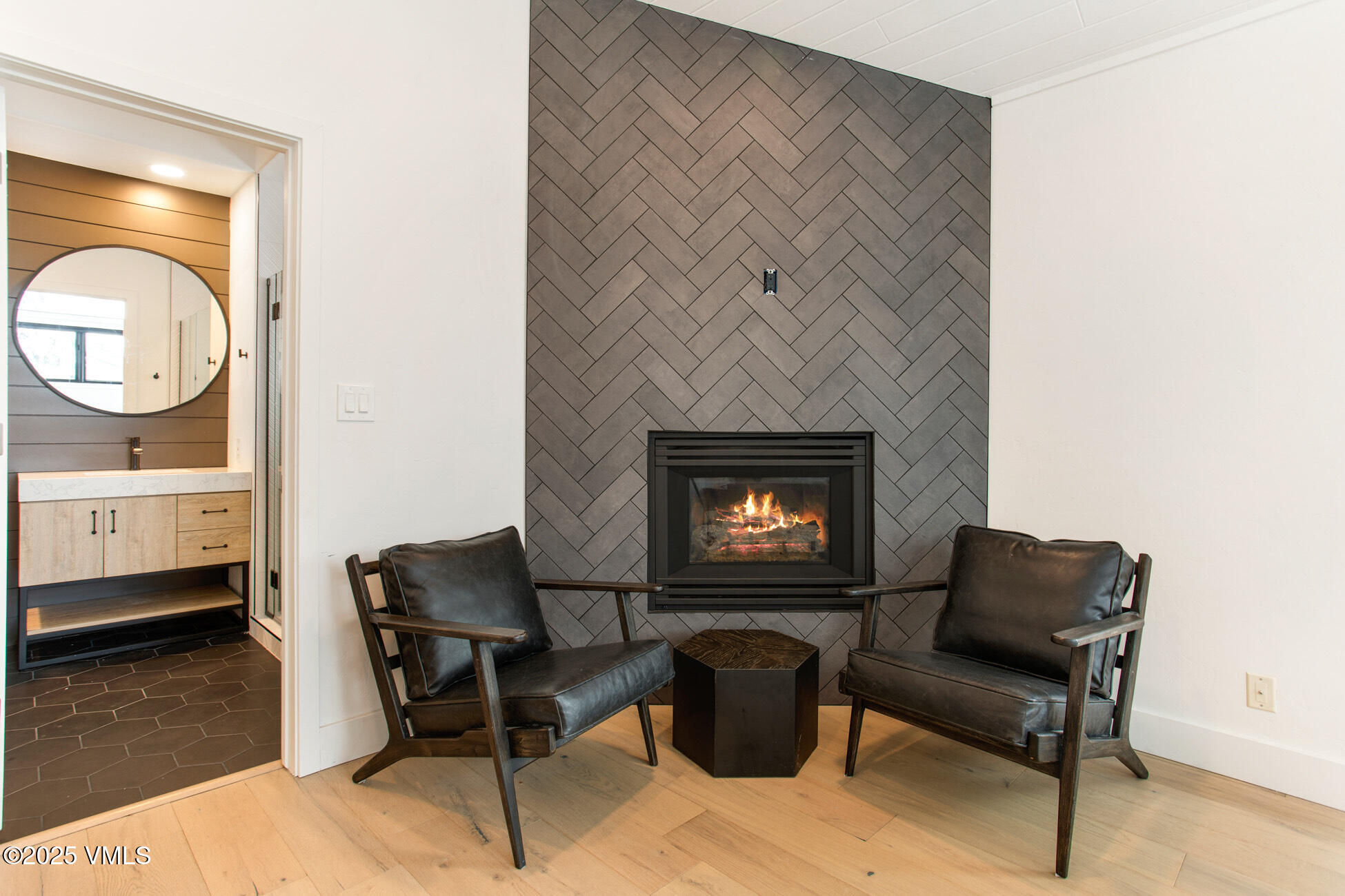 770 Potato Patch Drive, Unit H Vail, CO 81657 - Photo 5 of 6 a living room with furniture a fireplace and a table