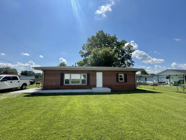 a house view with swimming pool and yard