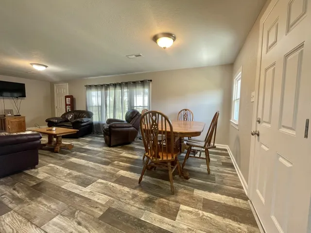 a living room with furniture and a rug
