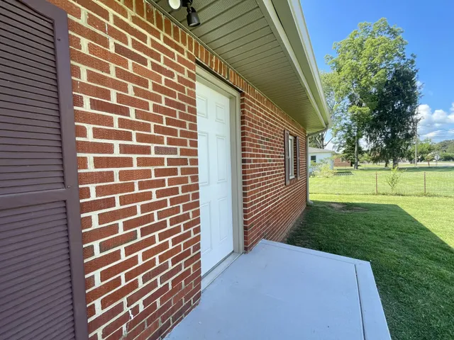 a backyard of a house with a garden and entertaining space