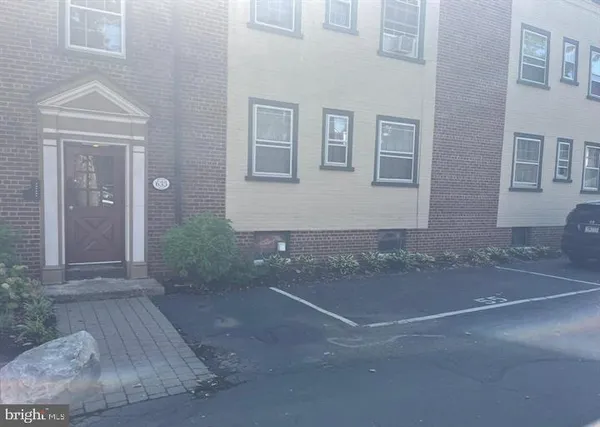 a view of a house with a street
