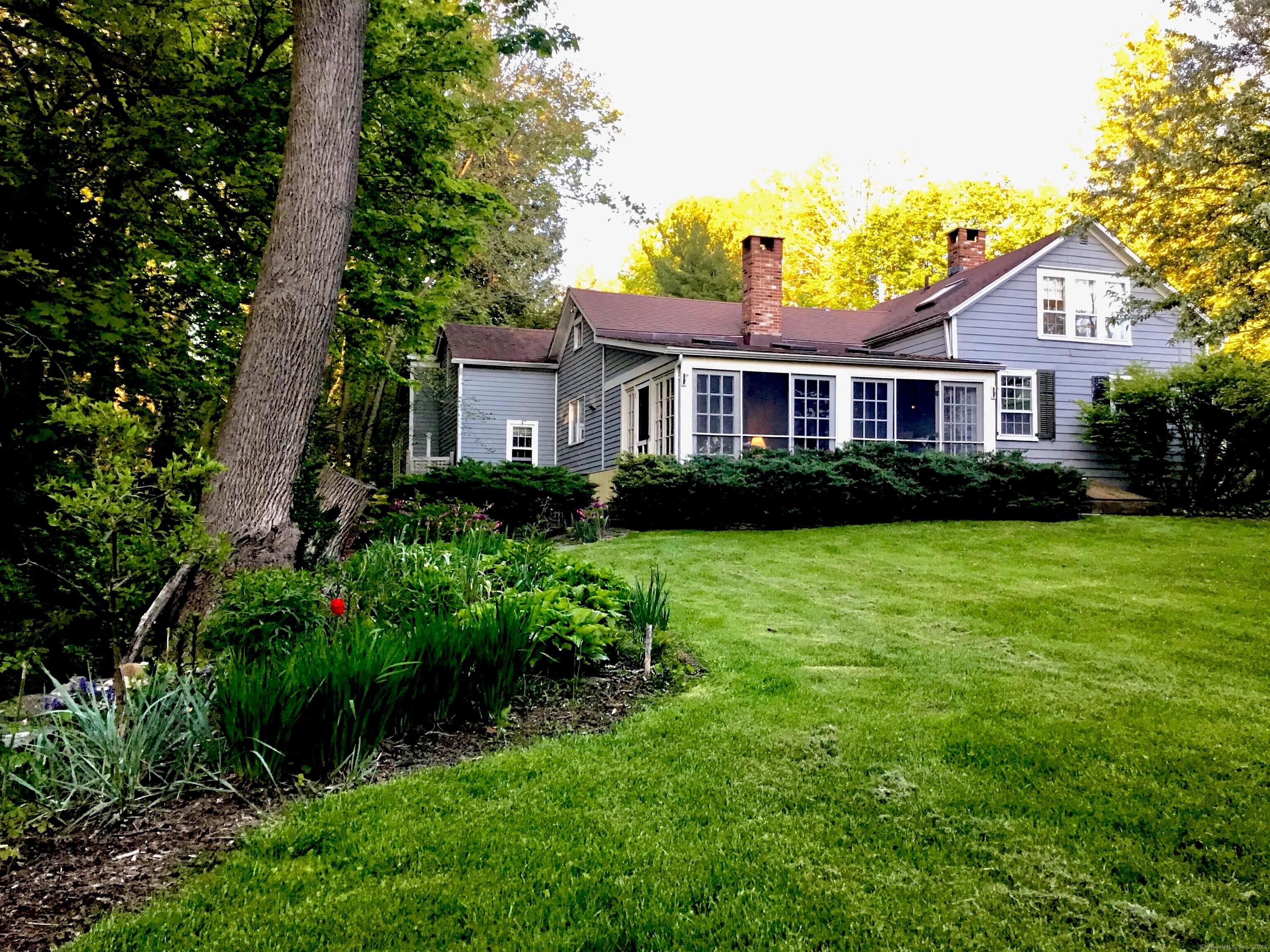 22 Calkinstown Road Sharon, CT 06069 - Photo 1 of 1 a front view of a house with a garden