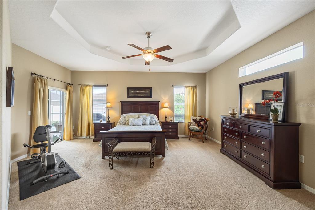 2836 Whitney Street Lakeland, FL 33813 - Photo 15 of 44 a bedroom with a bed and wooden floor