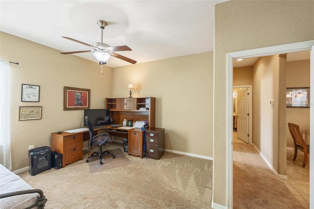 2836 Whitney Street Lakeland, FL 33813 - Photo 26 of 44 a view of a workspace with furniture and a window