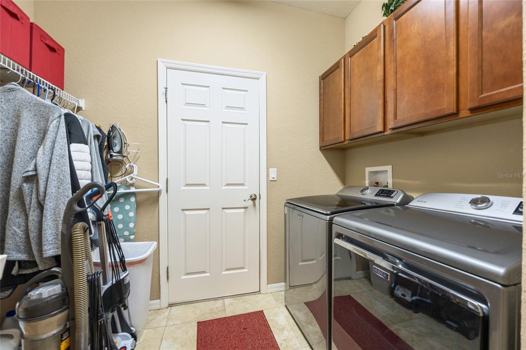 2836 Whitney Street Lakeland, FL 33813 - Photo 30 of 44 a view of a storage and utility room with washer and dryer