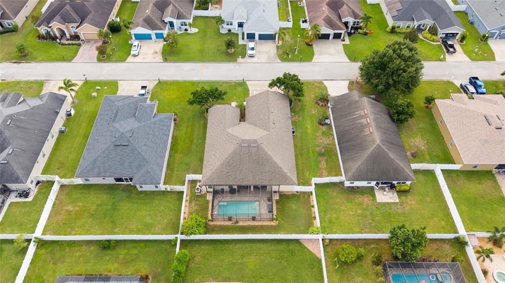 2836 Whitney Street Lakeland, FL 33813 - Photo 39 of 44 an aerial view of residential houses with outdoor space and swimming pool