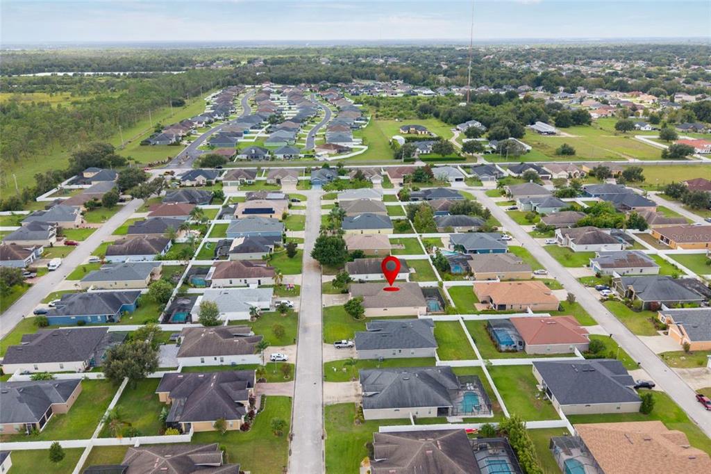 2836 Whitney Street Lakeland, FL 33813 - Photo 42 of 44 an aerial view of residential houses with outdoor space and ocean view