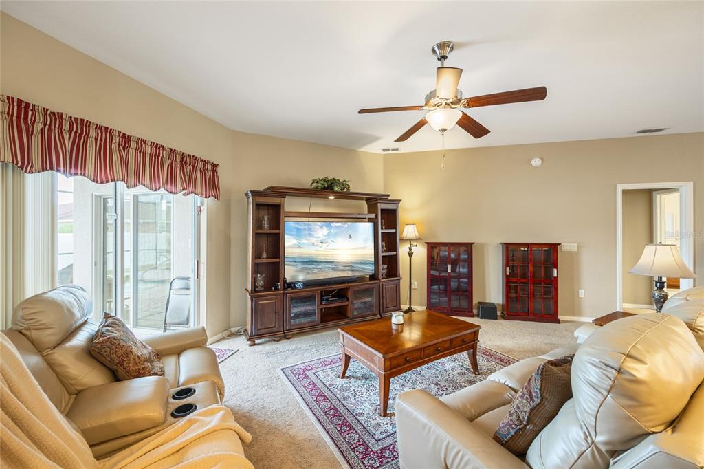 2836 Whitney Street Lakeland, FL 33813 - Photo 5 of 44 a living room with furniture and a flat screen tv