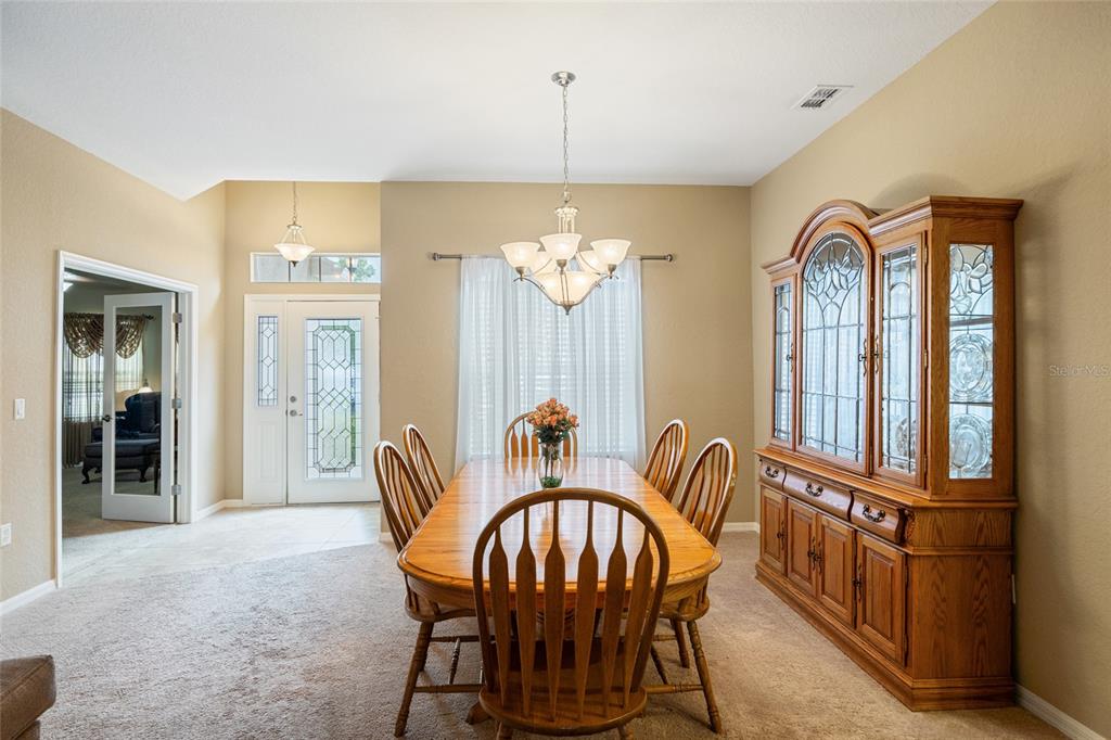 2836 Whitney Street Lakeland, FL 33813 - Photo 7 of 44 a view of a dining room with furniture window and wooden floor