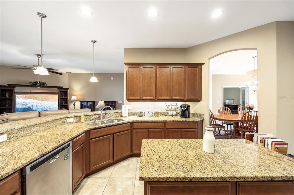 2836 Whitney Street Lakeland, FL 33813 - Photo 10 of 44 a kitchen with a stove a sink a dining table and chairs