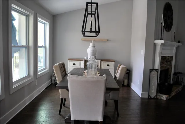 a bathroom with a granite countertop sink mirror and toilet