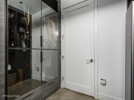 a bathroom with a glass shower door