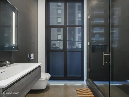 a bathroom with a tub and shower
