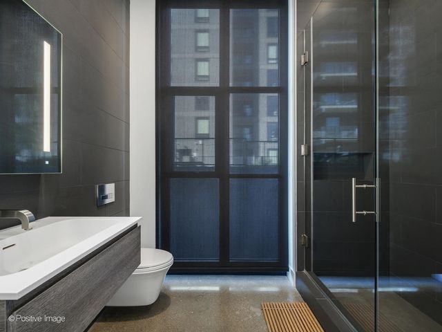 a bathroom with a tub and shower