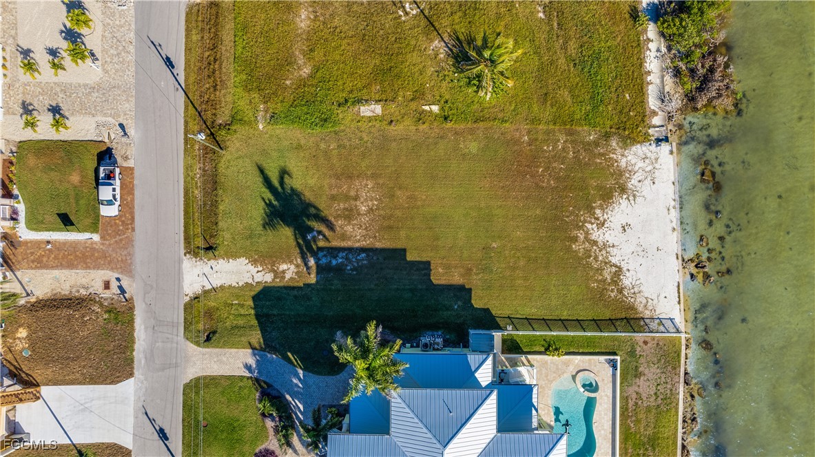3429 First Avenue St. James City, FL 33956 - Photo 4 of 8 an aerial view of residential house with outdoor space