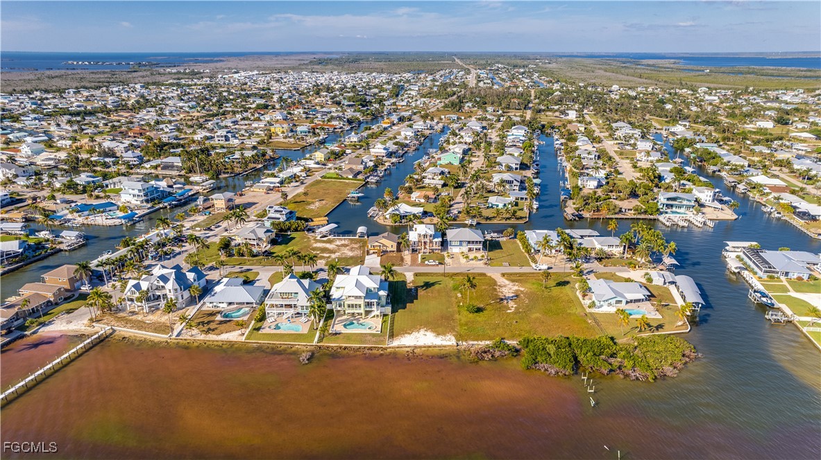 3429 First Avenue St. James City, FL 33956 - Photo 8 of 8 an aerial view of residential building and parking space