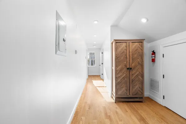 a view of livingroom with hardwood floor and hallway