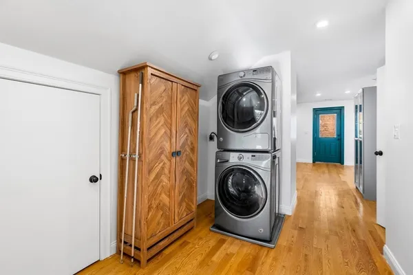 a view of a hallway with washer and dryer