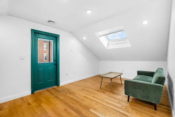 a workspace room with furniture and a window