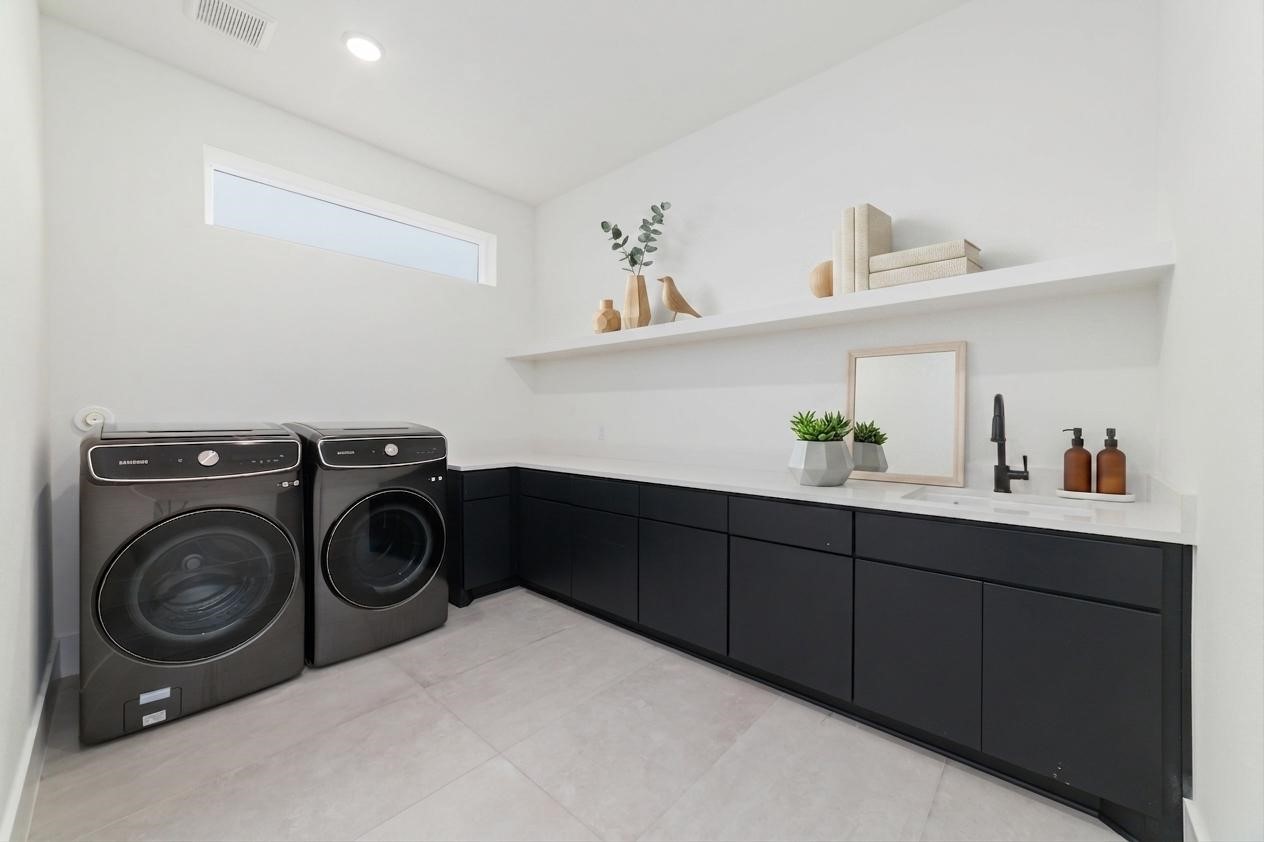 29627 Cir S Rnch Trail Fulshear, TX 77406 - Photo 41 of 50 This isn't simply a laundry room. With abundant cabinetry, generous workspace, and an adjoining mudroom, it's designed to make everyday life feel just a little easier.