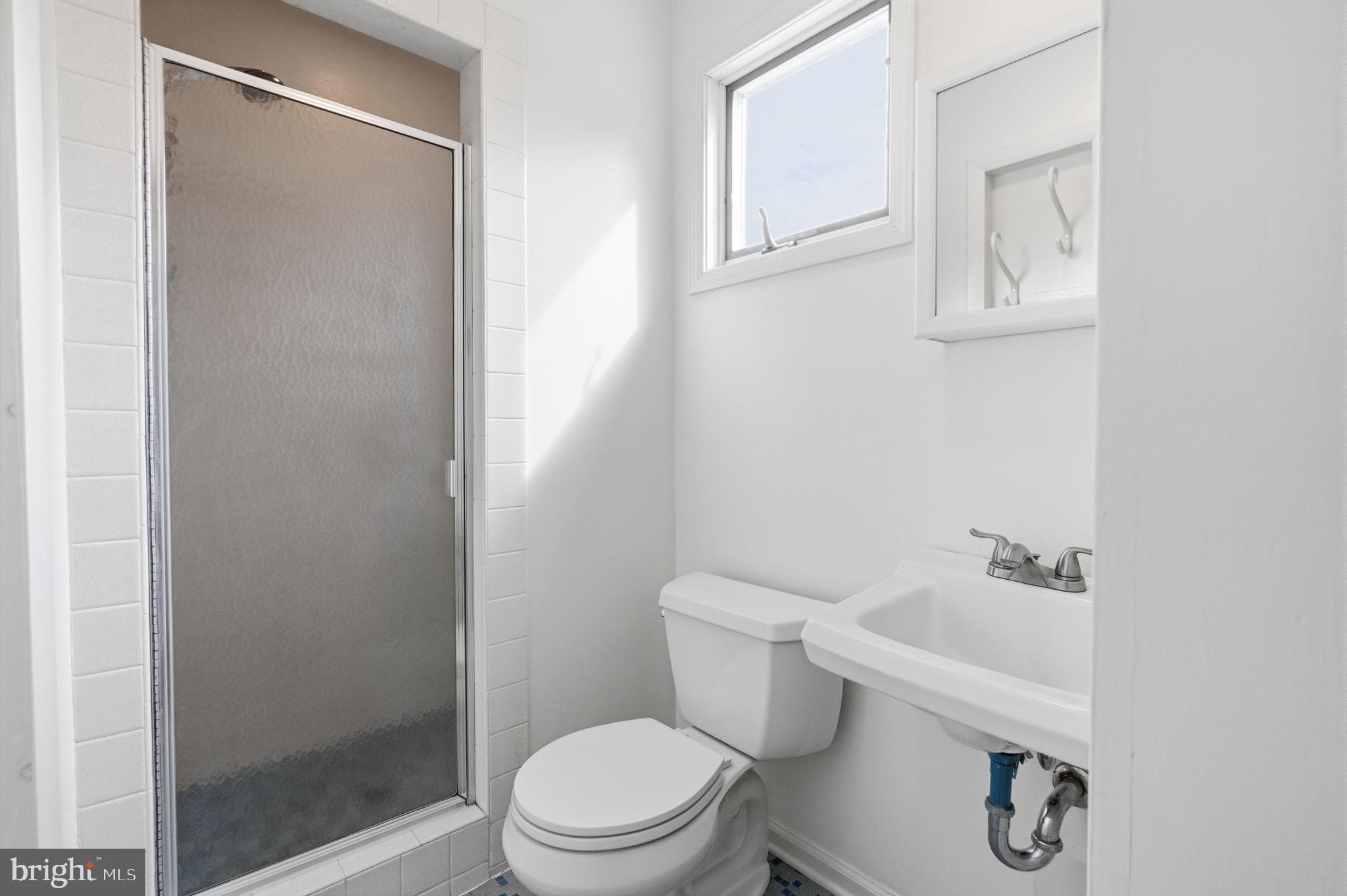 81 Cherokee Road Doylestown, PA 18901 - Photo 21 of 43 a white toilet sitting next to a bathroom sink