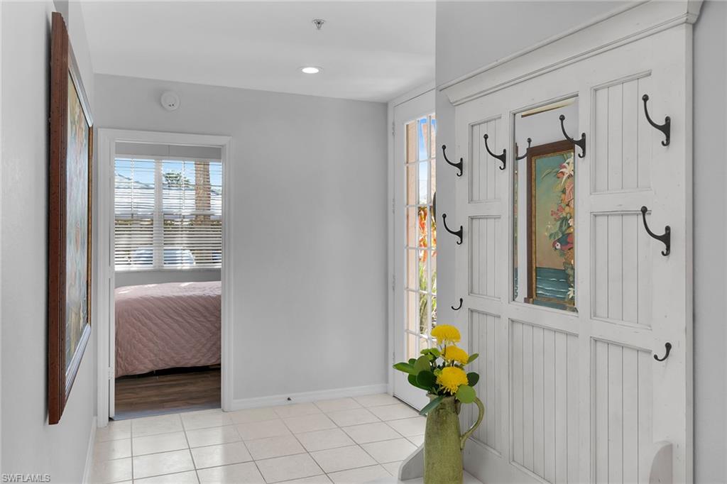 8345 Whisper Trace Way, Unit 102 Naples, FL 34114 - Photo 13 of 25 a view of an entryway with wooden floor