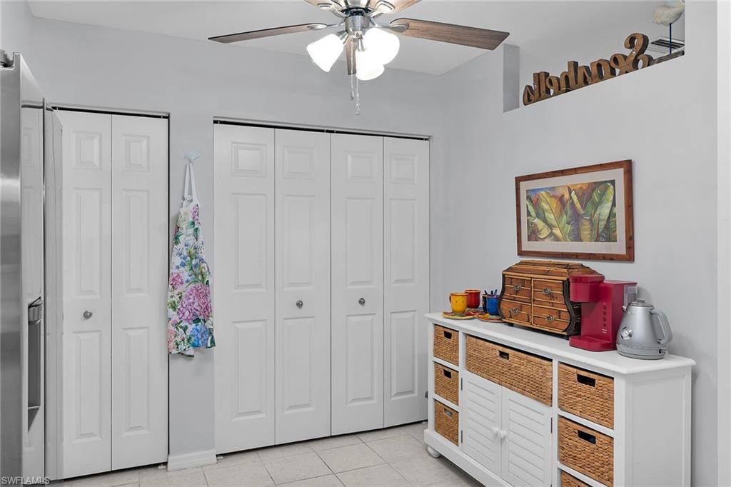 8345 Whisper Trace Way, Unit 102 Naples, FL 34114 - Photo 3 of 25 a bed room with a bed and a window