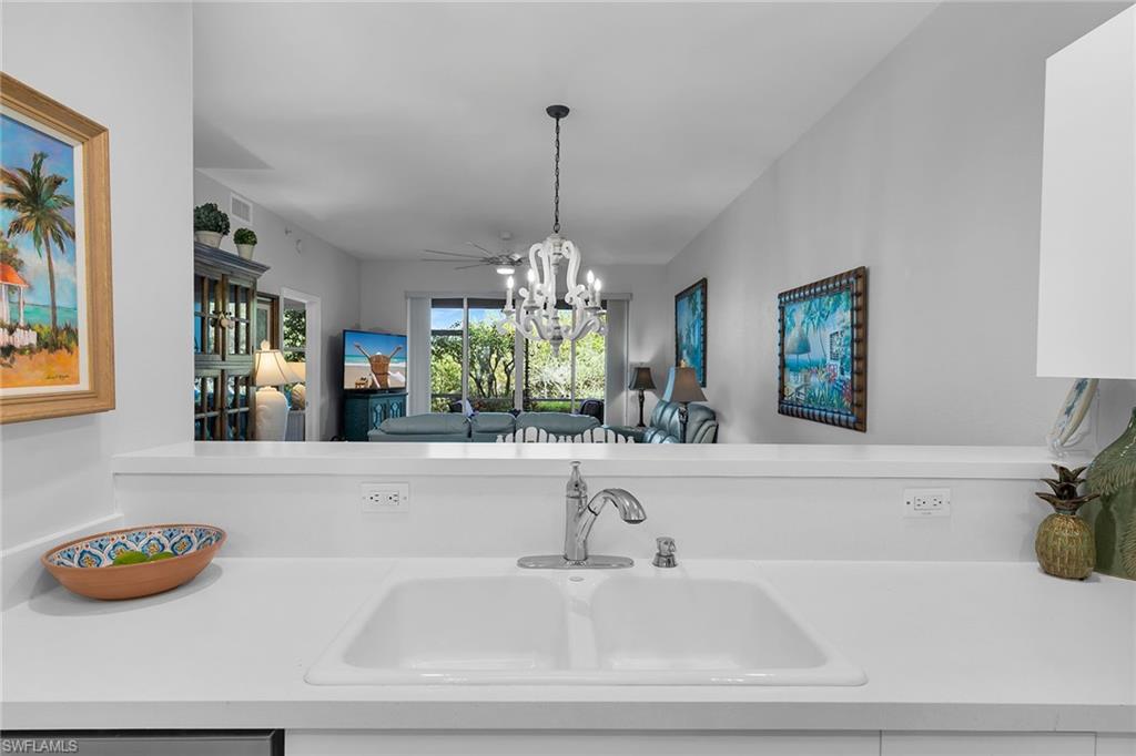 8345 Whisper Trace Way, Unit 102 Naples, FL 34114 - Photo 5 of 25 a bathroom with a bathtub sink and mirror
