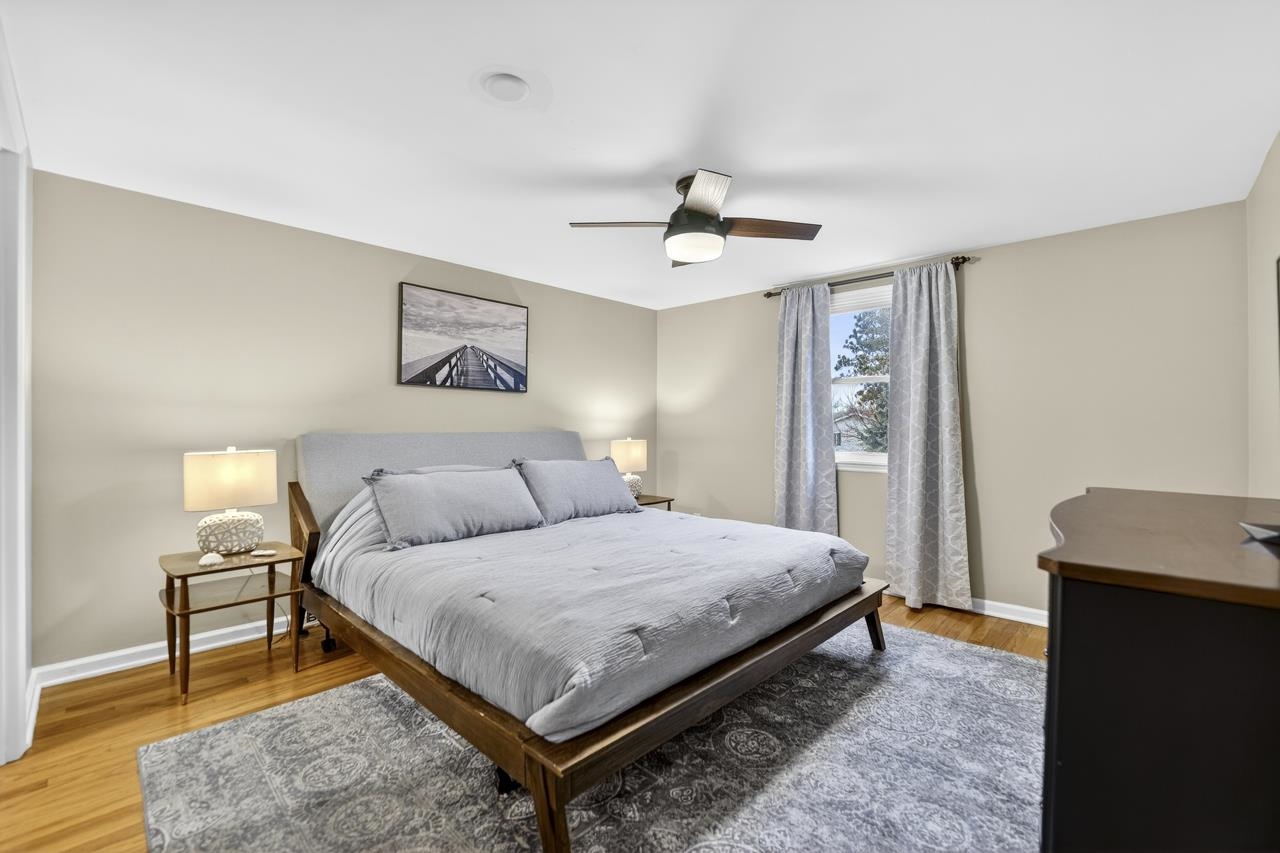 4966 Brigadoon Road Rockford, IL 61107 - Photo 17 of 40 a bedroom with a bed and a table in it