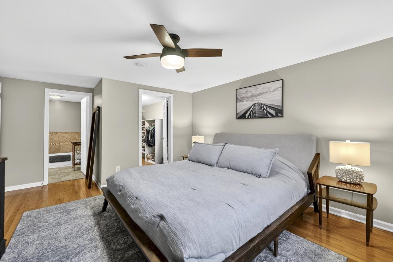4966 Brigadoon Road Rockford, IL 61107 - Photo 18 of 40 a bedroom with a bed and a dresser