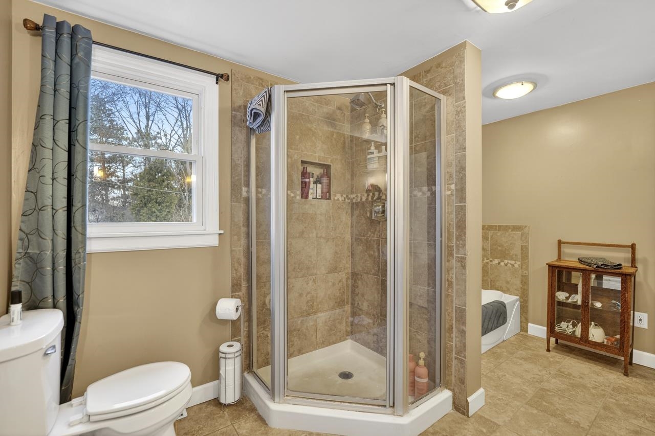 4966 Brigadoon Road Rockford, IL 61107 - Photo 20 of 40 a bathroom with a shower toilet and sink