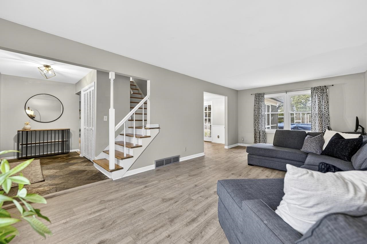 4966 Brigadoon Road Rockford, IL 61107 - Photo 5 of 40 a living room with furniture and a wooden floor