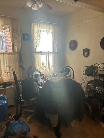 a dining room with furniture and a window