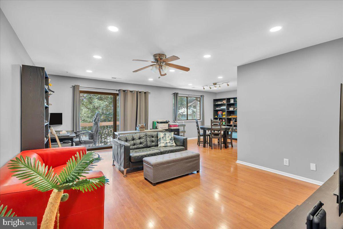 115 East Kings Highway, Unit 334 Maple Shade, NJ 08052 - Photo 11 of 26 a living room with furniture and a large window