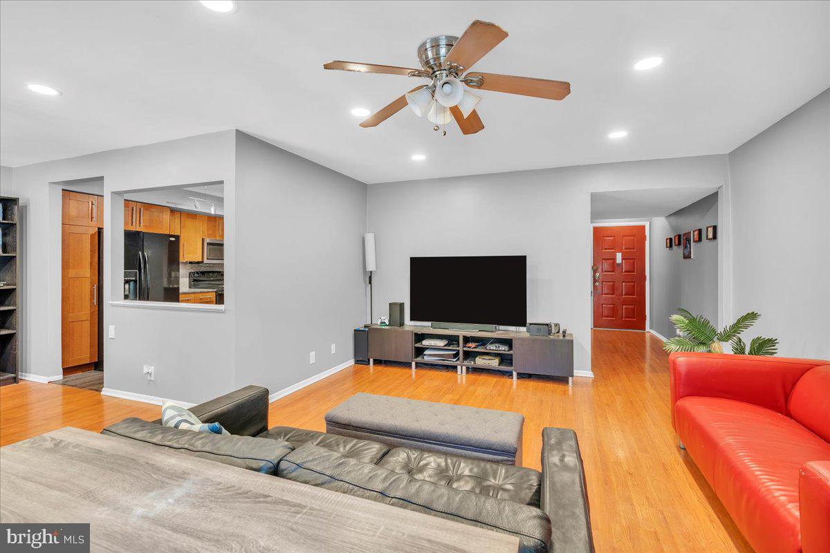 115 East Kings Highway, Unit 334 Maple Shade, NJ 08052 - Photo 12 of 26 a living room with furniture and a flat screen tv