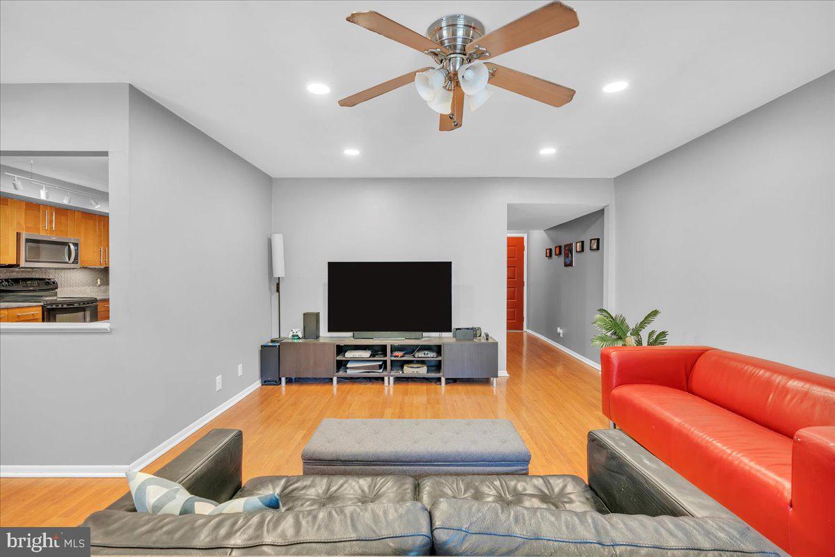 115 East Kings Highway, Unit 334 Maple Shade, NJ 08052 - Photo 19 of 26 a living room with furniture and a flat screen tv