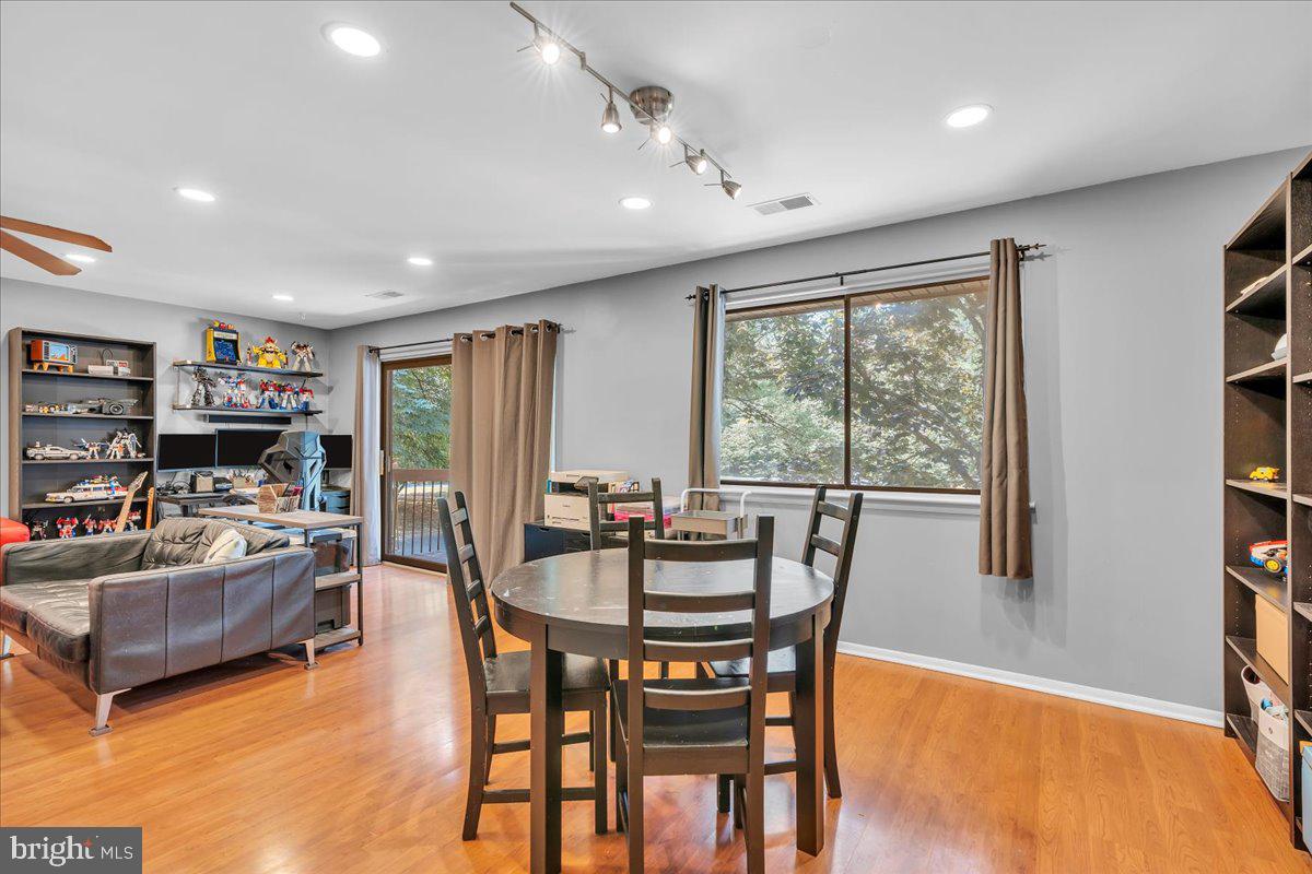 115 East Kings Highway, Unit 334 Maple Shade, NJ 08052 - Photo 20 of 26 a dining room with furniture a window and wooden floor