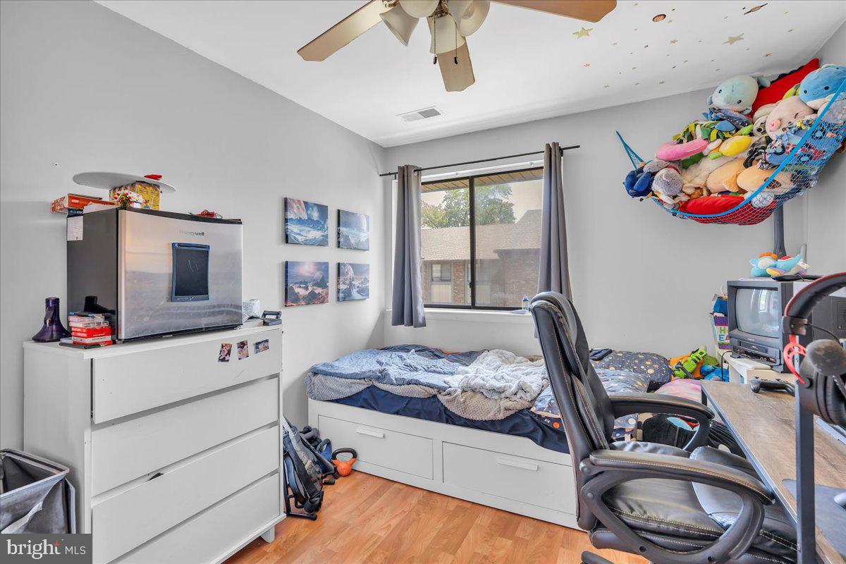 115 East Kings Highway, Unit 334 Maple Shade, NJ 08052 - Photo 22 of 26 a bedroom with a bed and a tv