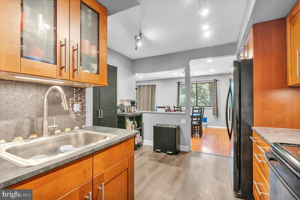 115 East Kings Highway, Unit 334 Maple Shade, NJ 08052 - Photo 26 of 26 a kitchen with stainless steel appliances granite countertop a sink and a refrigerator