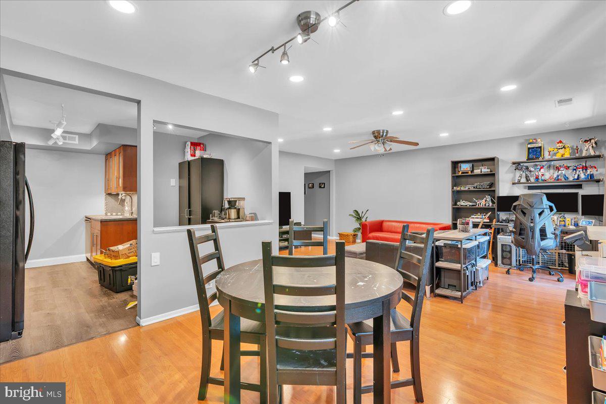 115 East Kings Highway, Unit 334 Maple Shade, NJ 08052 - Photo 3 of 26 a dining room with lots of furniture and a chandelier