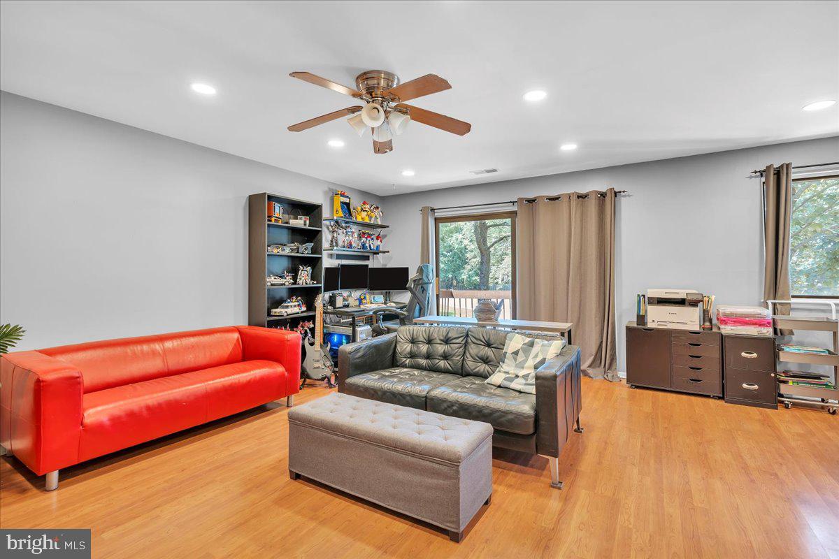 115 East Kings Highway, Unit 334 Maple Shade, NJ 08052 - Photo 4 of 26 a living room with furniture and a flat screen tv