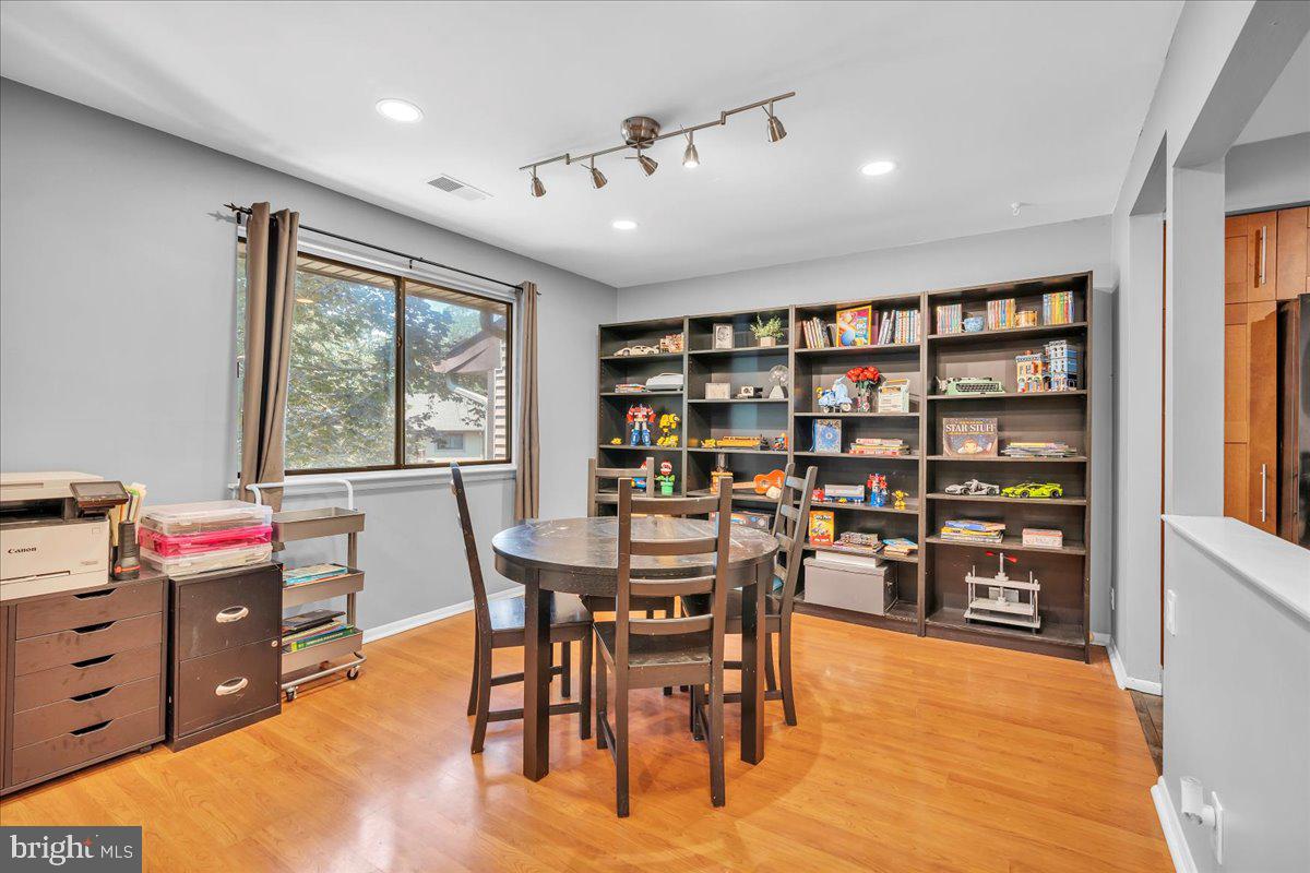 115 East Kings Highway, Unit 334 Maple Shade, NJ 08052 - Photo 7 of 26 a view of a workspace with furniture and a bookshelf