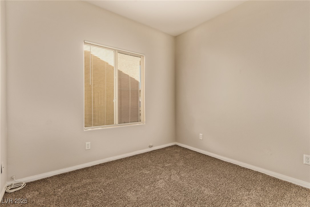 6224 Boulder Rise Street Las Vegas, NV 89115 - Photo 19 of 26 Empty room featuring carpet floors and baseboards