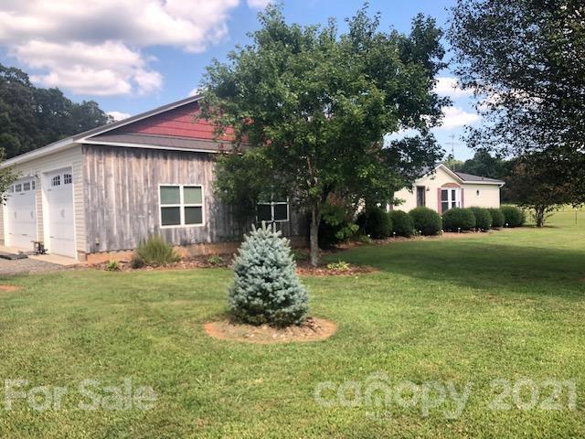 3485 Organ Church Road Rockwell, NC 28138 - Photo 2 of 33 a front view of a house with a garden