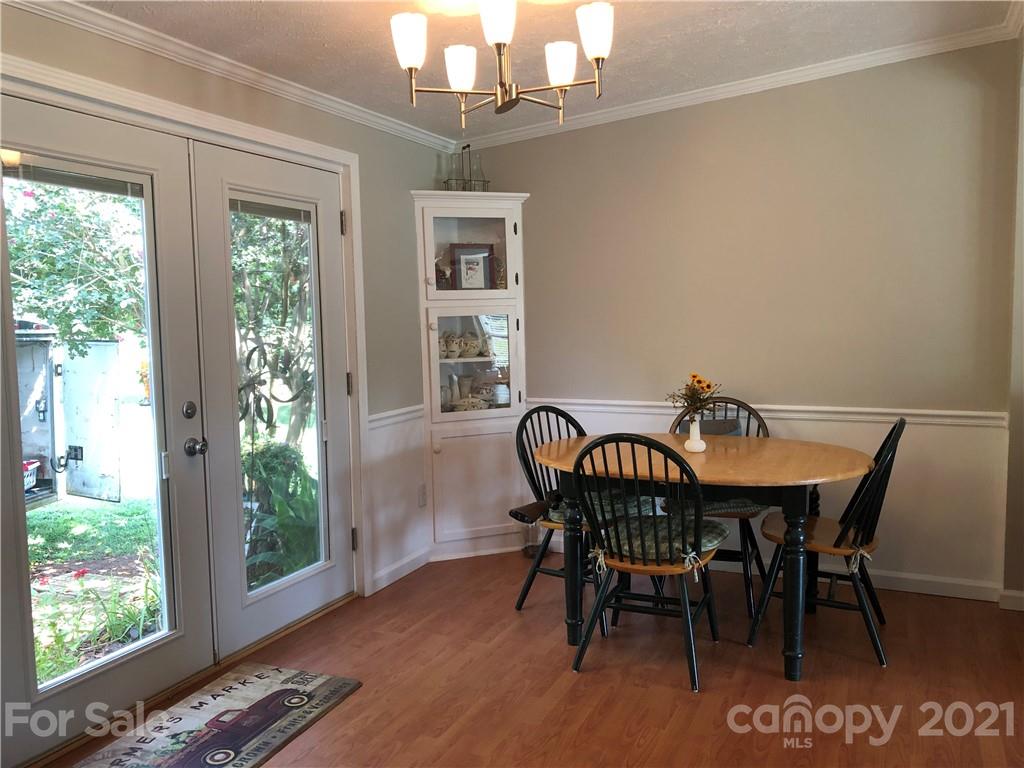 3485 Organ Church Road Rockwell, NC 28138 - Photo 11 of 33 a view of a dining room with furniture window and wooden floor