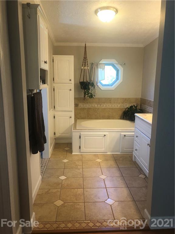 3485 Organ Church Road Rockwell, NC 28138 - Photo 13 of 33 a bathroom with a sink a toilet and a mirror
