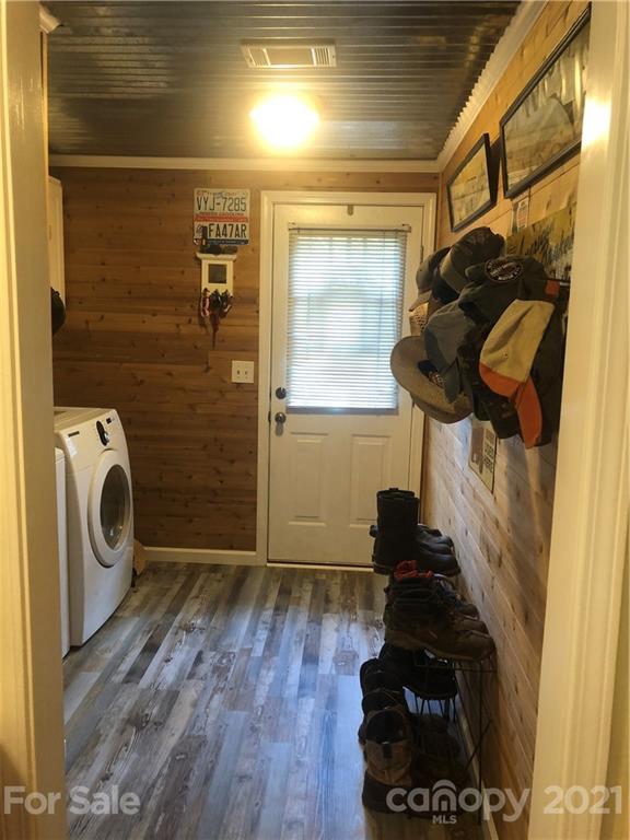 3485 Organ Church Road Rockwell, NC 28138 - Photo 19 of 33 a view of a hallway with wooden floor and a sink