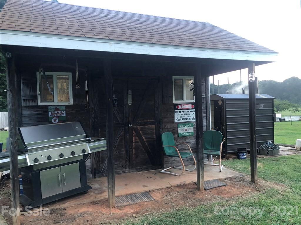 3485 Organ Church Road Rockwell, NC 28138 - Photo 33 of 33 a backyard of a house with barbeque oven