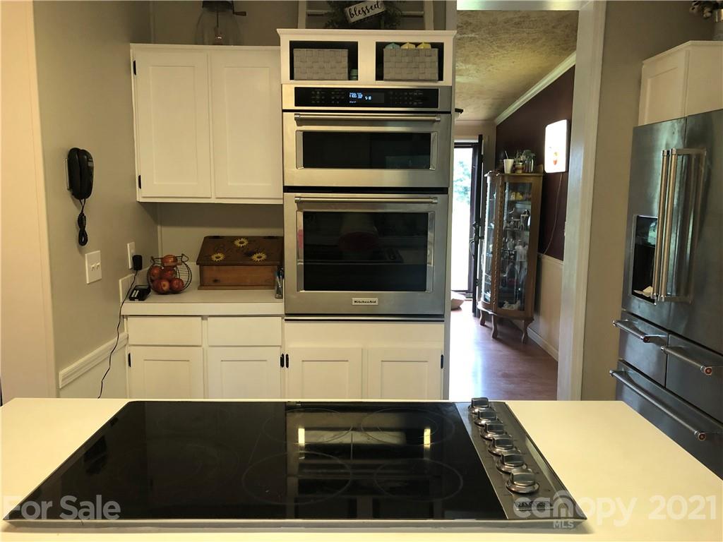 3485 Organ Church Road Rockwell, NC 28138 - Photo 6 of 33 a kitchen with a stove and a refrigerator